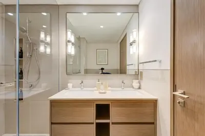 a bathroom with a sink and a shower at Ultra-Luxury 2BR with Burj Khalifa view Downtown in Dubai