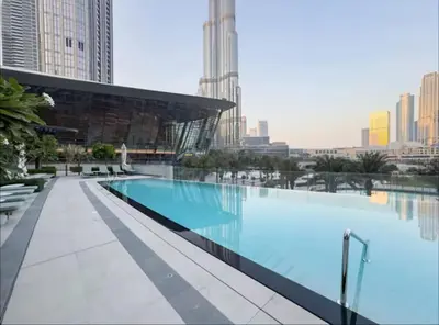 a large swimming pool on the roof of a building at Ultra-Luxury 2BR with Burj Khalifa view Downtown in Dubai