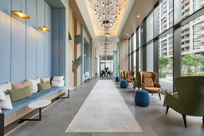 an office lobby with couches and chairs and windows at Luxury High-Floor Canal View near Burj Khalifa in Dubai