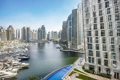 a view of a river in a city with boats at Beautiful Marina Skyline Serenity Spacious n Bright in Dubai