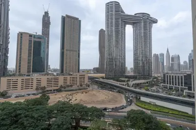 a view of a city with tall buildings at Premium 1BR in Downtown & Direct Access to Metro in Dubai