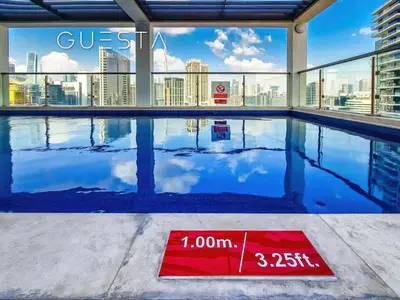 a swimming pool with a view of the city at Apartments at Millennium Atria, Business Bay in Dubai