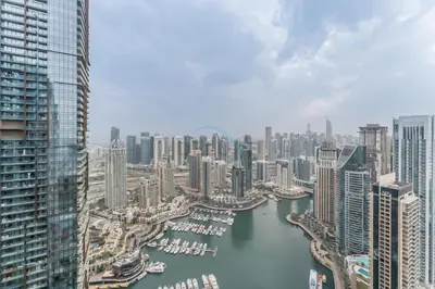 an aerial view of a city with a harbor at High-Floor 3BR with Balcony Overlooking the Marina, Near the Beach, Just Minutes Walk to the Tram, Damac Heights, Dubai Marina by Deluxe Holiday Homes in Dubai