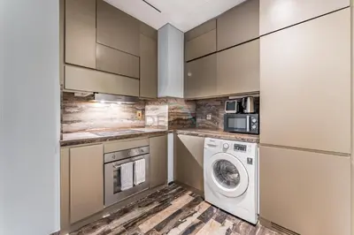 a laundry room with a washer and dryer at High-Floor 3BR with Balcony Overlooking the Marina, Near the Beach, Just Minutes Walk to the Tram, Damac Heights, Dubai Marina by Deluxe Holiday Homes in Dubai