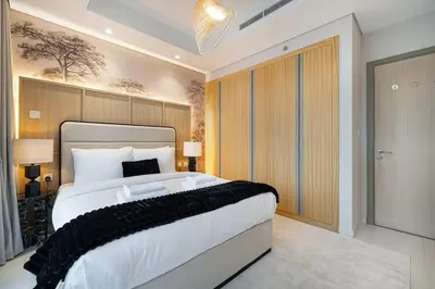 a bedroom with a large bed in a room at Premium 3BR Paramount Hotel Midtown Business Bay in Dubai
