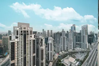 an aerial view of a city with tall buildings at Premium 3BR Paramount Hotel Midtown Business Bay in Dubai