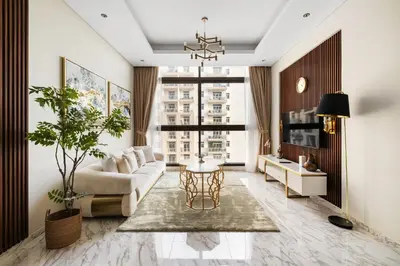 a living room with a couch and a table at Brand New 1BR Near Metro at Avenue Residence in Dubai