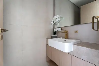 a bathroom with a white sink and a mirror at GuestReady - Spacious 1 bedroom apartment in Dubai