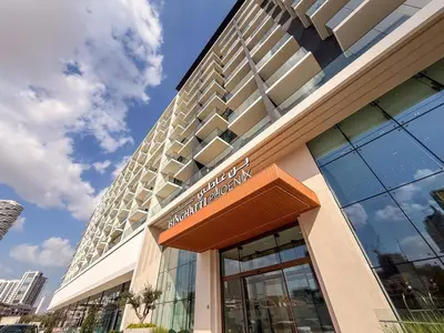 a building with a sign on the front of it at GuestReady - Spacious 1 bedroom apartment in Dubai
