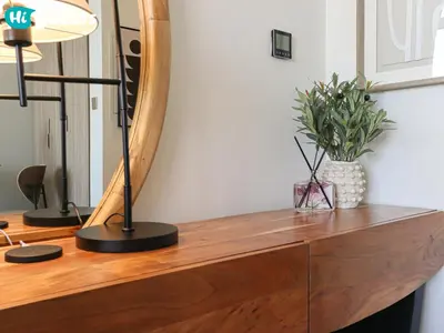 a desk with a lamp and a potted plant on it at HiGuests - Dubai Skyline Studio with Premier Views in Dubai