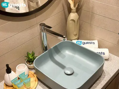 a blue sink on a counter in a bathroom at HiGuests - Dubai Skyline Studio with Premier Views in Dubai