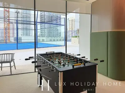 a large game room with a giant foos ball at LUX The Phantom Sky Pool Suite in Dubai