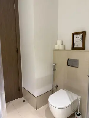 a bathroom with a white toilet in a room at Bluebell reidence jvc in Dubai