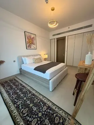 a bedroom with a large bed and a rug at Bluebell reidence jvc in Dubai