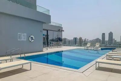 a swimming pool on the roof of a building at Bluebell reidence jvc in Dubai