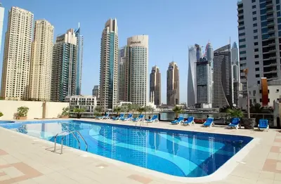 a large swimming pool on the roof of a building at Bright 2BR in Dubai Marina - Close to beach in Dubai