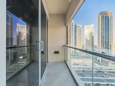 a glass elevator in a building with a view of the city at Direct Dubai Mall Access-Emaar Residences-1BR Like Home in Dubai