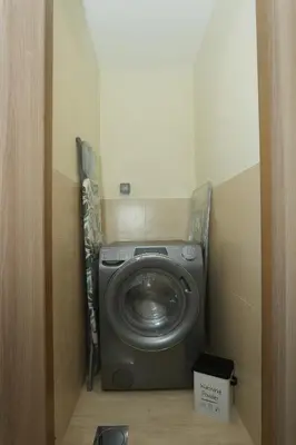 a washer and dryer in a small room at Luxury Brand New 2 BR Apartment Burj & Canal View Business Bay Dubai in Dubai