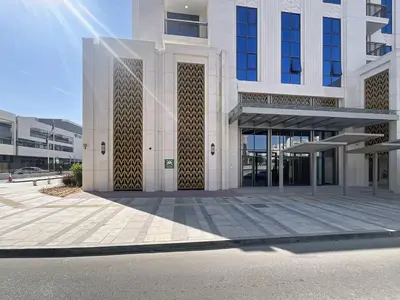 a large white building with a lot of windows at Vacationer l Elegant 1 Bed l Next to Metro l Near Mall in Dubai