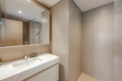 a bathroom with a sink and a mirror at Luxury 2 bed, 5 mins walk to Dubai Mall and Burj Khalifa in Dubai