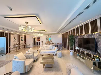 a large living room with white furniture and a flat screen tv at Panoramic Fireworks Views with Palm Jumeirah Bluewaters and Ain dubai View in Dubai