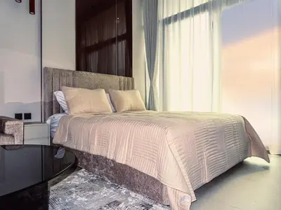 a bedroom with a large bed with a large window at Stylish new apartment with Burj and Downtown views in Dubai