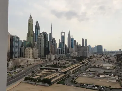 a view of a large city with tall buildings at Stylish new apartment with Burj and Downtown views in Dubai