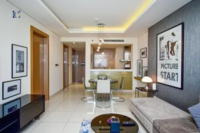 a living room with a couch and a table at Luxury Escapes Premium 1BR - Paramount Tower Business Bay in Dubai