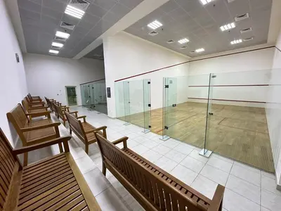 a row of benches in a gym with a basketball court at Charming 2BR in Dubai Marina with Lake View in Dubai