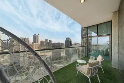 a balcony with a view of a city skyline at Luxury 2BR in Mada Residences - Walk to Dubai Mall in Dubai