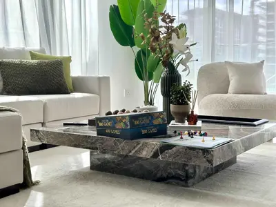 a living room with a marble coffee table at Silkhaus Luxury New Tower in City Walk in Dubai