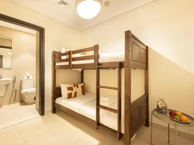 a bathroom with two bunk beds in a room at Downtown Views Suites by Prestige Nest in Dubai