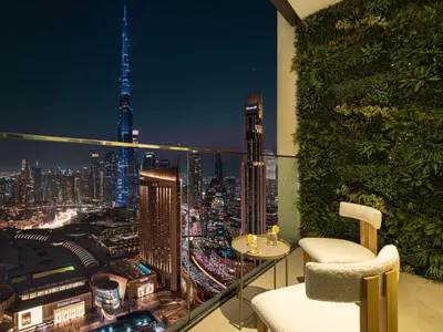 a balcony with a view of a city at night at Downtown Views Suites by Prestige Nest in Dubai
