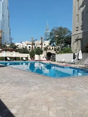 a swimming pool in the middle of a city at Stylish Apartment in Le Pont Jumeirah Near Beach in Dubai