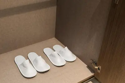 a group of white shoes sitting on a counter at Blissful Stays - Luxury Two Bedroom Apartment at ACT Tower 2, Boulevard, Burj Khalifa, Pool, Near Dubai Mall in Dubai
