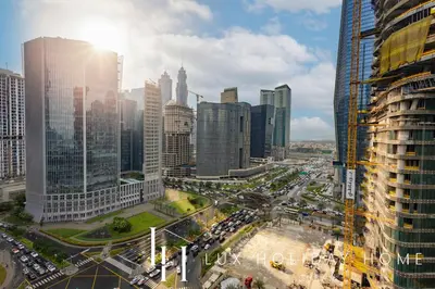 a view of a busy city with buildings and traffic at LUX The Business Bay Executive Suite in Dubai