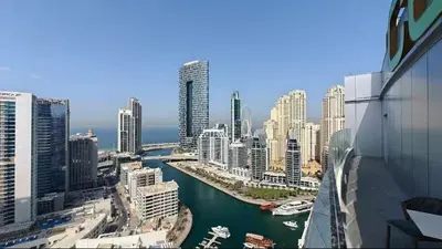 a view of a city with a river and buildings at Vogue Marina, Condor Marina Star near Ain Dubai and JBR Beach, One Bedroom Apartment with Balcony and City View, Access to all Amenities in Dubai