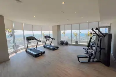 a gym with cardio equipment in a building with a view at Vogue Marina, Condor Marina Star near Ain Dubai and JBR Beach, One Bedroom Apartment with Balcony and City View, Access to all Amenities in Dubai