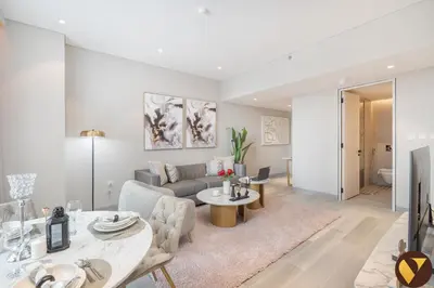 a living room with a couch and a table at Vogue Marina, Condor Marina Star near Ain Dubai and JBR Beach, One Bedroom Apartment with Balcony and City View, Access to all Amenities in Dubai