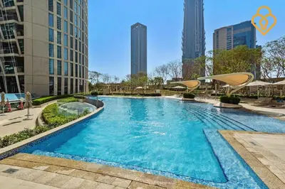 a swimming pool in a city with tall buildings at Seaview 3 BR Burj Vista Connected to Dubai Mall in Dubai