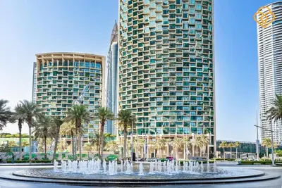 a water fountain in front of two tall buildings at Seaview 3 BR Burj Vista Connected to Dubai Mall in Dubai