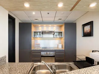 a kitchen with a sink and a counter top at Dream Shoma - 2R Serene Apt Direct Marina access in Dubai