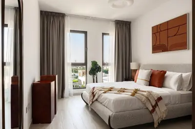 a bedroom with a bed and a couch at Designer 1BR with Skyline View in MJL - Near Iconic Burj Al in Dubai