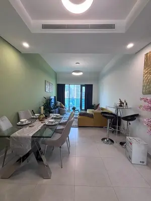 a living room with a table and a dining room at High-Floor 1BR Escape - The Bay Rooftop Pool in Dubai
