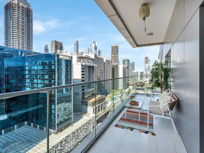 a balcony with a view of the city at NEW Noma Majestine Hotel Style Apt Business Bay in Dubai
