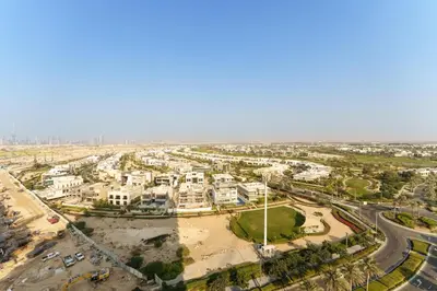 an aerial view of a city with buildings and roads at Maison Privee - Tranquil Living with Golf Course Vws in Dubai Hills in Dubai