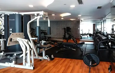 a gym with cardio equipment and tread machines at HAVN - High Floor 1 bedroom in JLT in Dubai