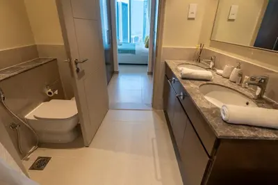 a bathroom with a toilet and a sink at HAVN - High Floor 2 bedroom in Downtown in Dubai