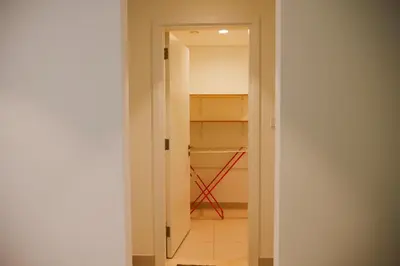 an empty hallway with a closet in a room at HAVN - High Floor 2 bedroom in The Grand in Dubai