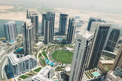 an aerial view of a city with tall buildings at HAVN - High Floor 2 bedroom in The Grand in Dubai